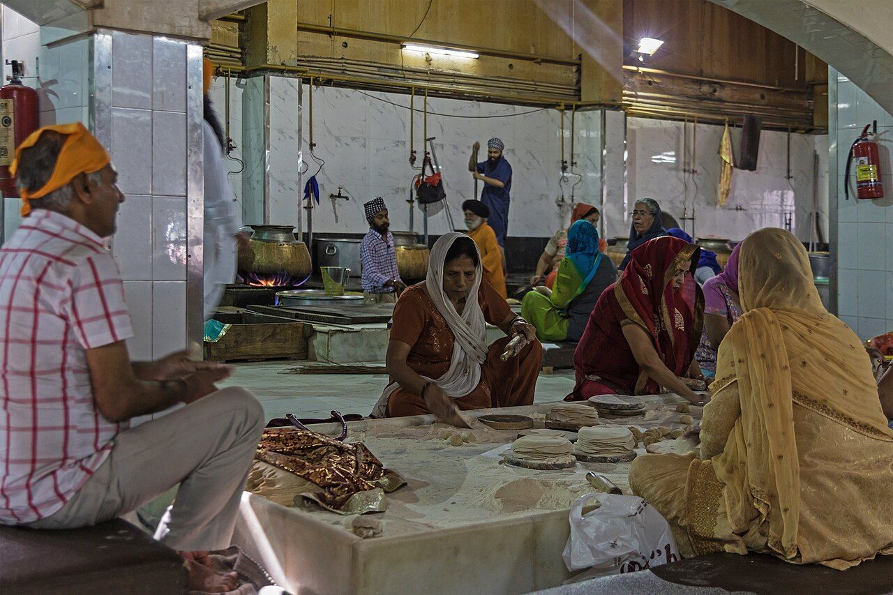 Volunteers rolling rotis for the langar