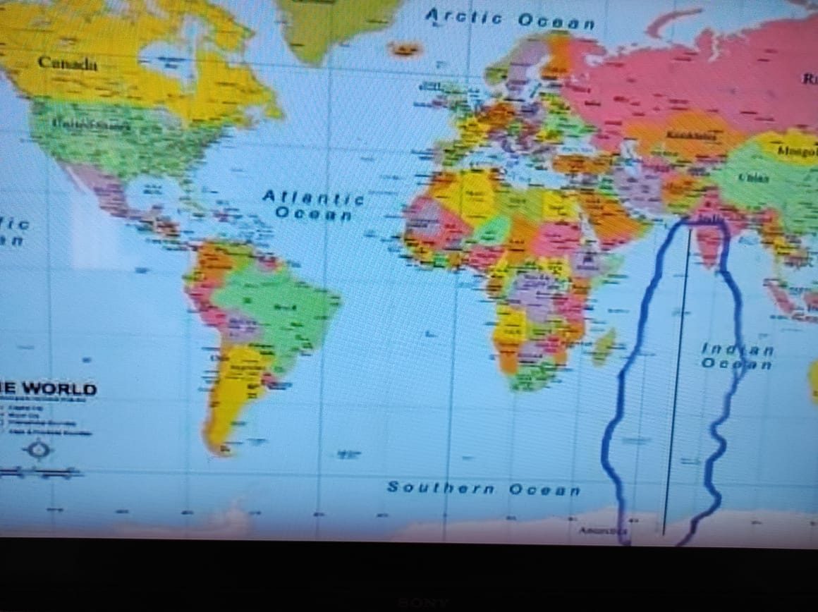 The arrow's path to the South Pole on a world map
